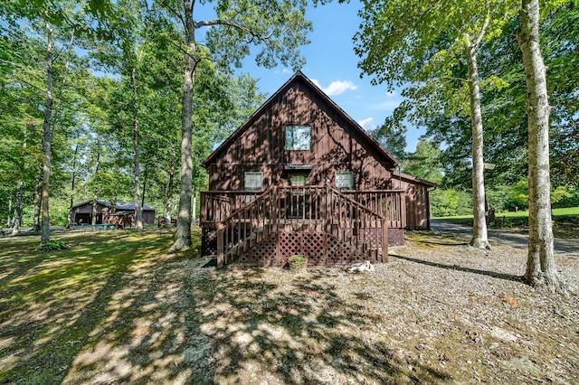 back of house with stairway and a deck