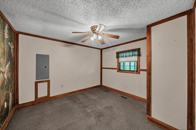 spare room featuring a textured ceiling, carpet floors, electric panel, and crown molding