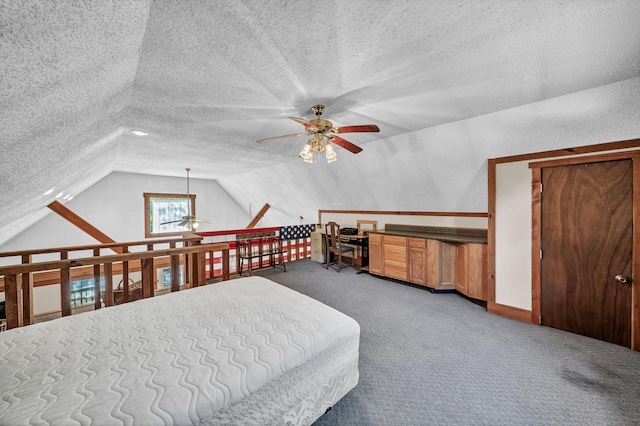 carpeted bedroom with vaulted ceiling and a textured ceiling