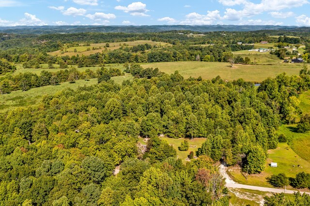 birds eye view of property with a wooded view