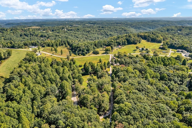 drone / aerial view featuring a forest view