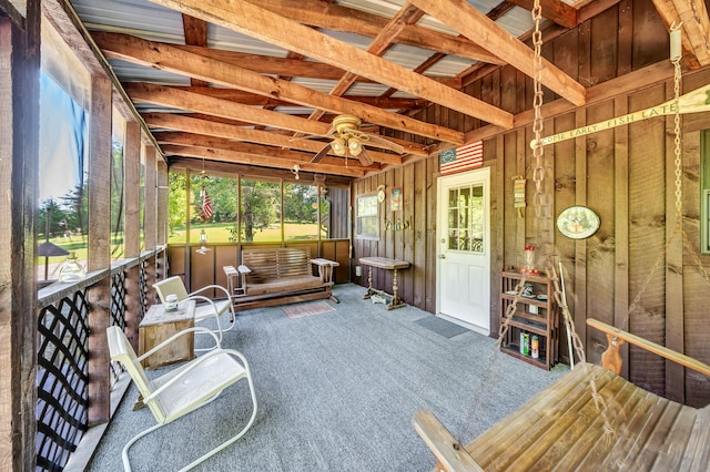 sunroom / solarium featuring ceiling fan