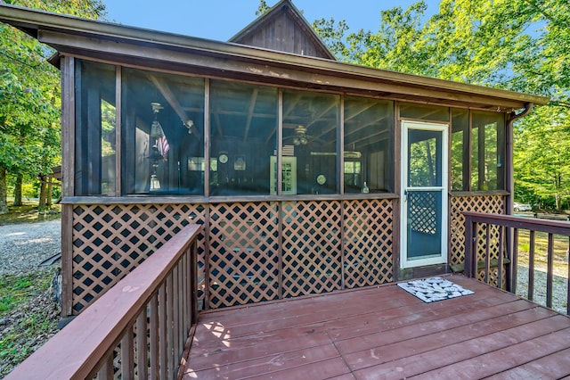 wooden deck featuring a sunroom