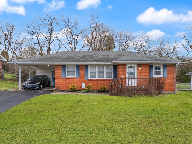 single story home featuring a carport and a front lawn