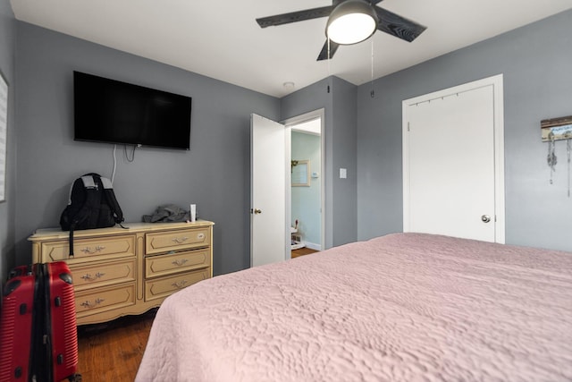 bedroom with dark wood-type flooring and ceiling fan