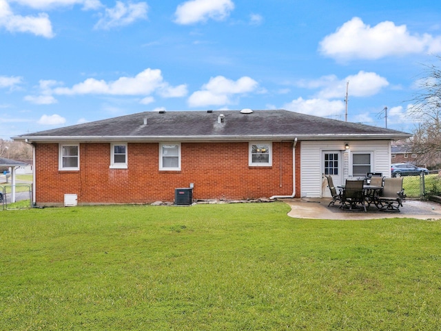 back of house with a lawn, a patio, and central air condition unit