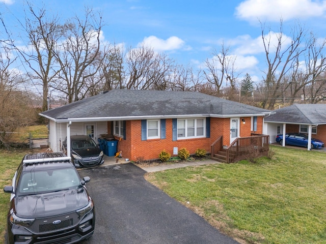 single story home with a carport and a front yard