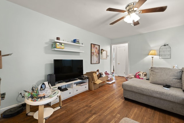 living room with dark wood-type flooring and ceiling fan