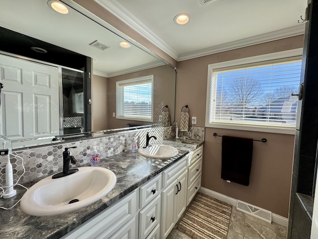 bathroom featuring vanity, backsplash, and crown molding