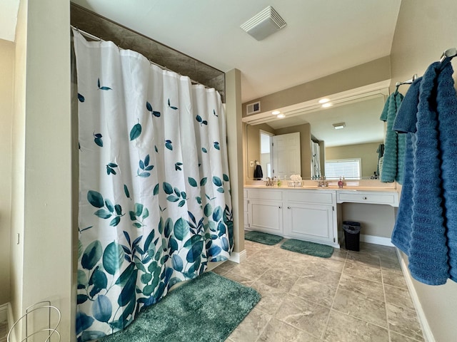 bathroom with vanity and a shower with curtain