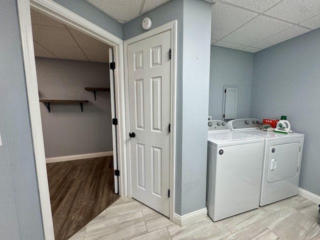 laundry area featuring light hardwood / wood-style flooring and washer and dryer