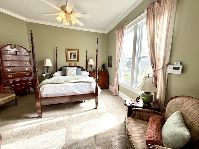 bedroom featuring ornamental molding, carpet, and ceiling fan