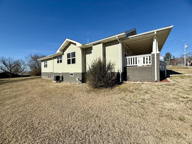 rear view of property featuring central air condition unit