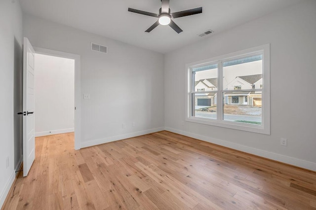 spare room featuring ceiling fan and light wood-type flooring