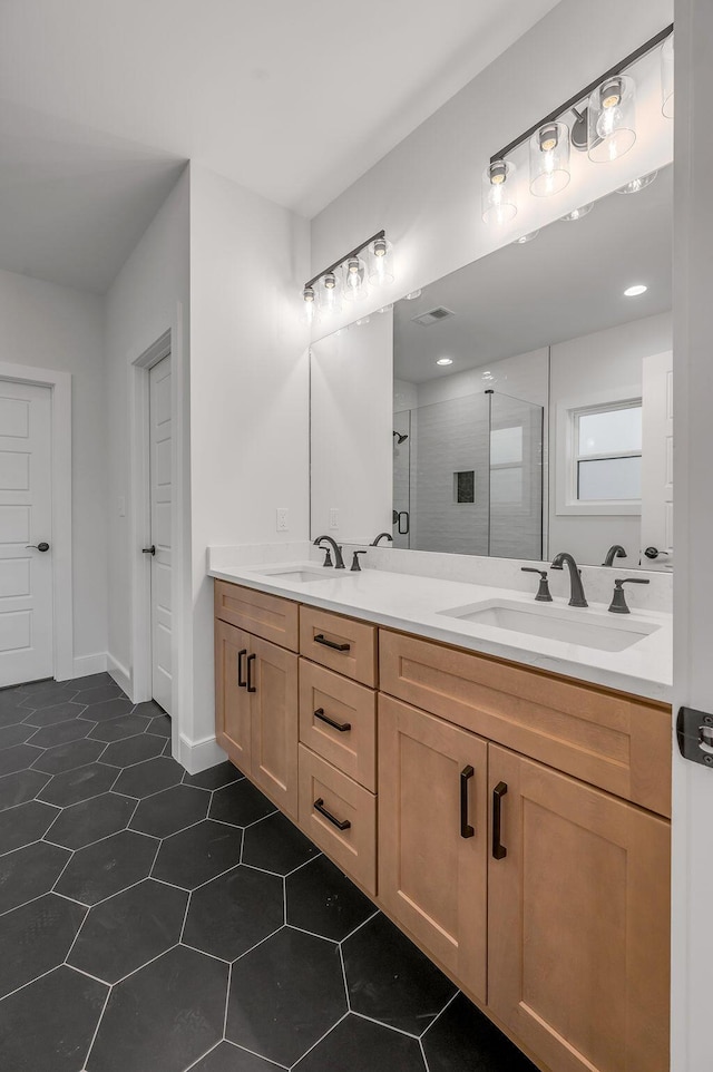 bathroom featuring an enclosed shower and vanity