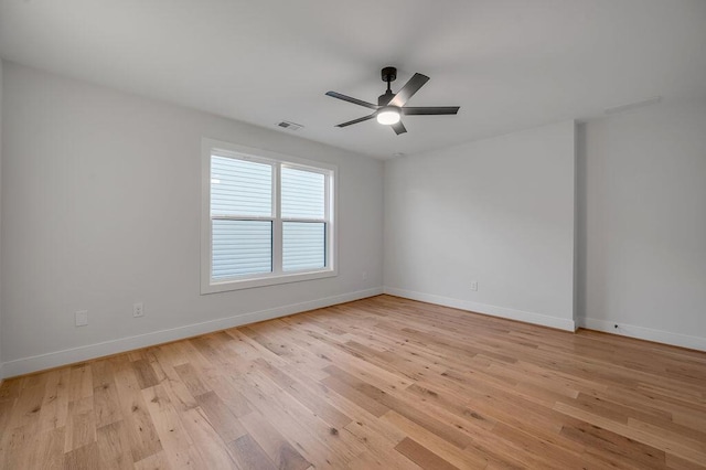 unfurnished room with ceiling fan and light hardwood / wood-style floors