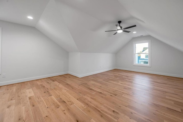 bonus room featuring ceiling fan, vaulted ceiling, and light wood-type flooring