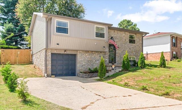 view of front of property with a garage and a front lawn