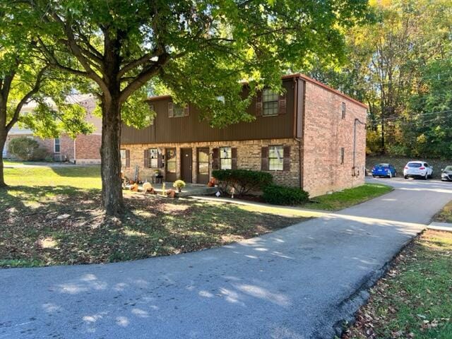 view of front of home featuring brick siding