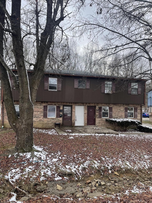 view of front of home with brick siding