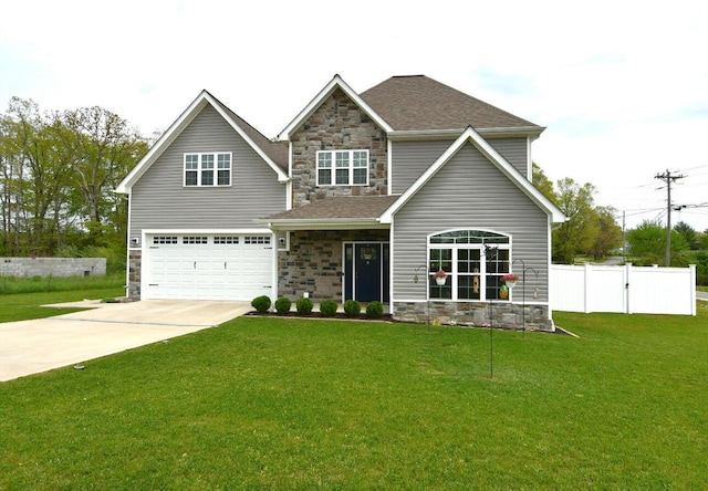 craftsman house with a front yard and a garage