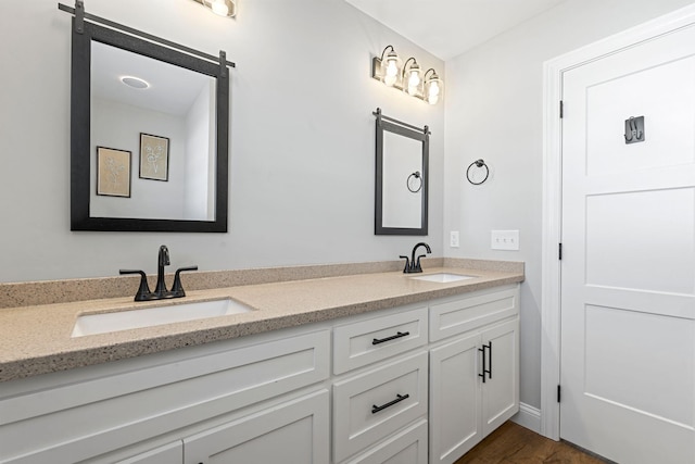 bathroom with double vanity and a sink