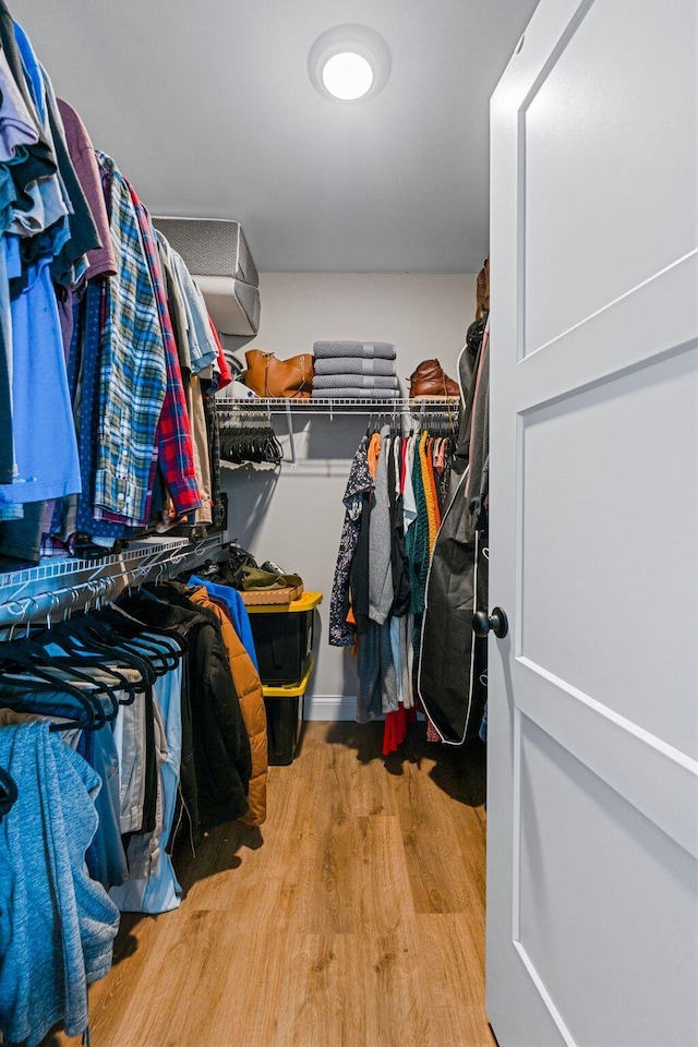 spacious closet with wood finished floors