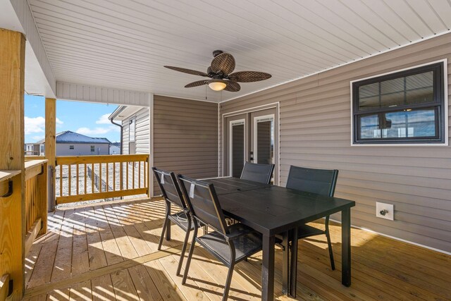 deck with ceiling fan and outdoor dining area