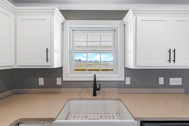 kitchen with visible vents, wood finished floors, stainless steel appliances, white cabinetry, and a sink