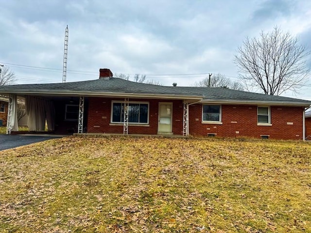 single story home featuring a carport and a front lawn