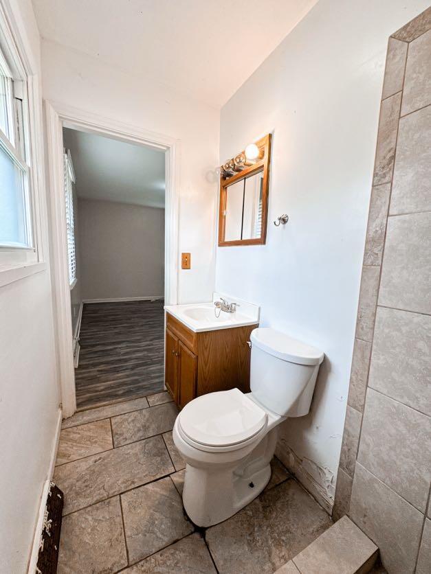 bathroom featuring vanity and toilet