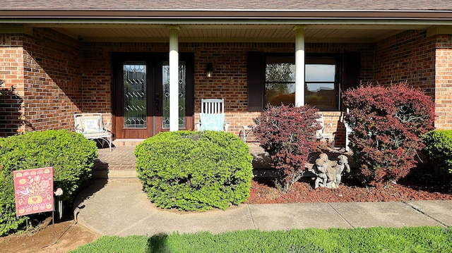 920 Meadow Ln, Harrodsburg, KY 40330 - doorway to property featuring covered porch, brick siding, and a shingled roof