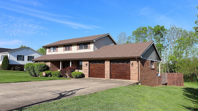 920 Meadow Ln, Harrodsburg, KY 40330 - view of front of house featuring driveway, a shingled roof, an attached garage, brick siding, and a front lawn