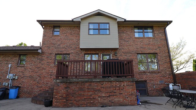 920 Meadow Ln, Harrodsburg, KY 40330 - back of house featuring a wooden deck, a patio area, and brick siding