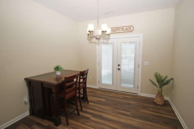 dining room featuring a notable chandelier, dark hardwood / wood-style floors, and french doors