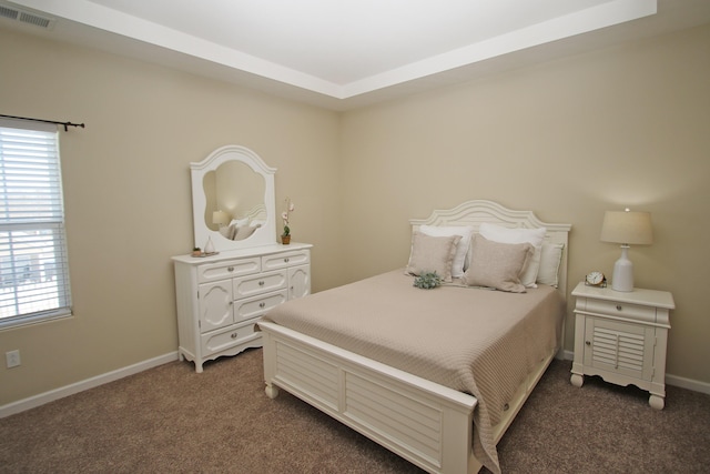 bedroom featuring dark colored carpet