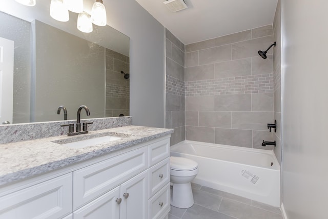 bathroom with shower / bathtub combination, visible vents, toilet, vanity, and tile patterned floors