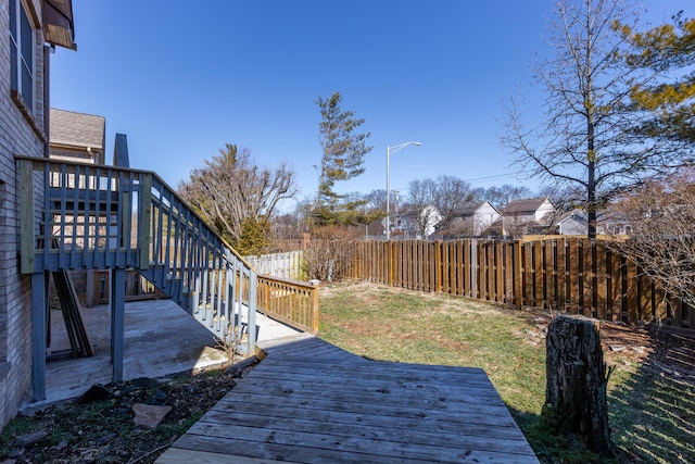 view of yard featuring a patio area, a fenced backyard, and a deck