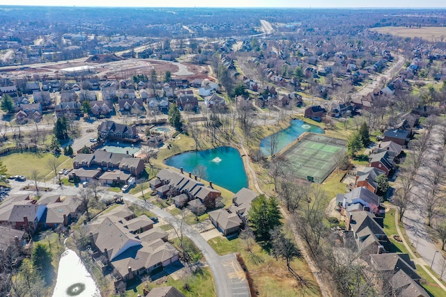 birds eye view of property featuring a residential view and a water view