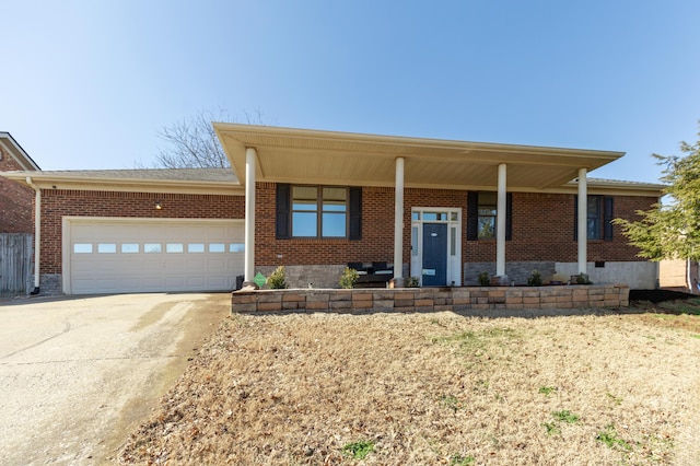 single story home featuring concrete driveway, brick siding, crawl space, and an attached garage