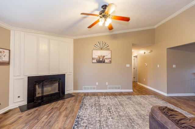 living room with visible vents and wood finished floors