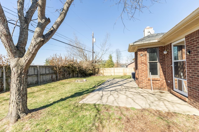 view of yard with a fenced backyard and a patio