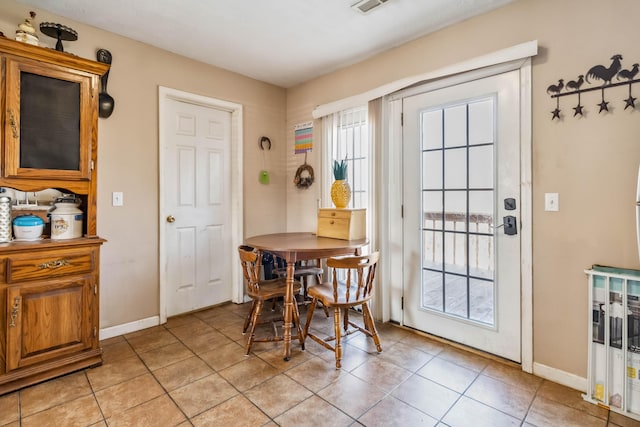 dining room with light tile patterned floors