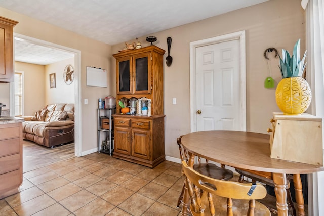 dining space with light tile patterned floors