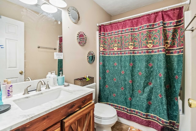 bathroom with vanity, curtained shower, tile patterned floors, and toilet