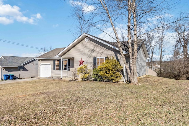 view of front of house with a garage and a front yard