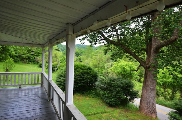 wooden deck with a yard