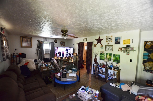 living room featuring cooling unit, ceiling fan, and a textured ceiling