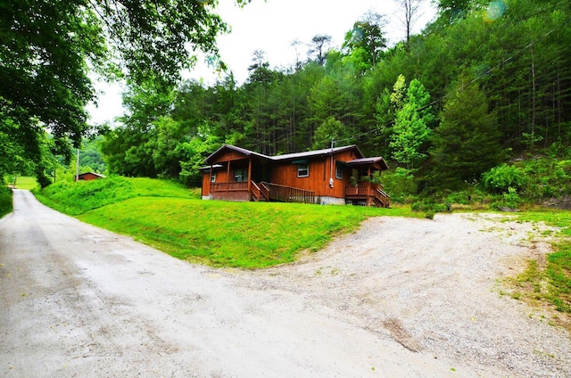 view of front of house featuring a porch and a front yard