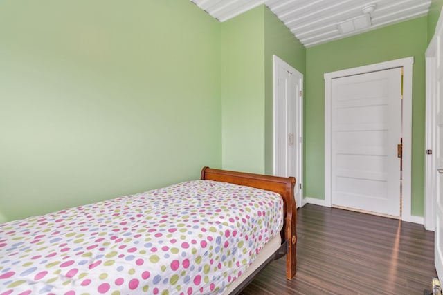 bedroom featuring dark hardwood / wood-style floors